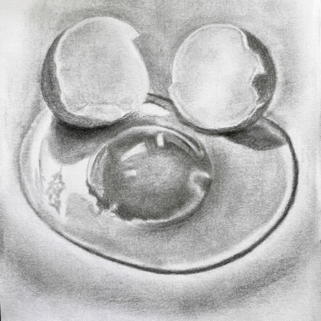 Graphite pencil drawing of a cracked egg with two shell halves and yolk pooling on a surface