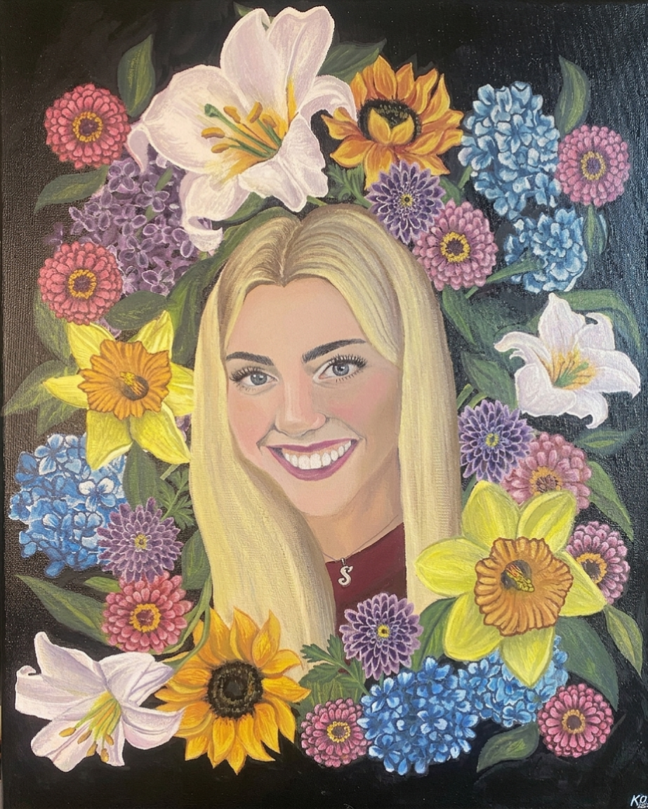 Acrylic portrait of a smiling young woman with long blonde hair surrounded by a wreath of colorful flowers on a black background